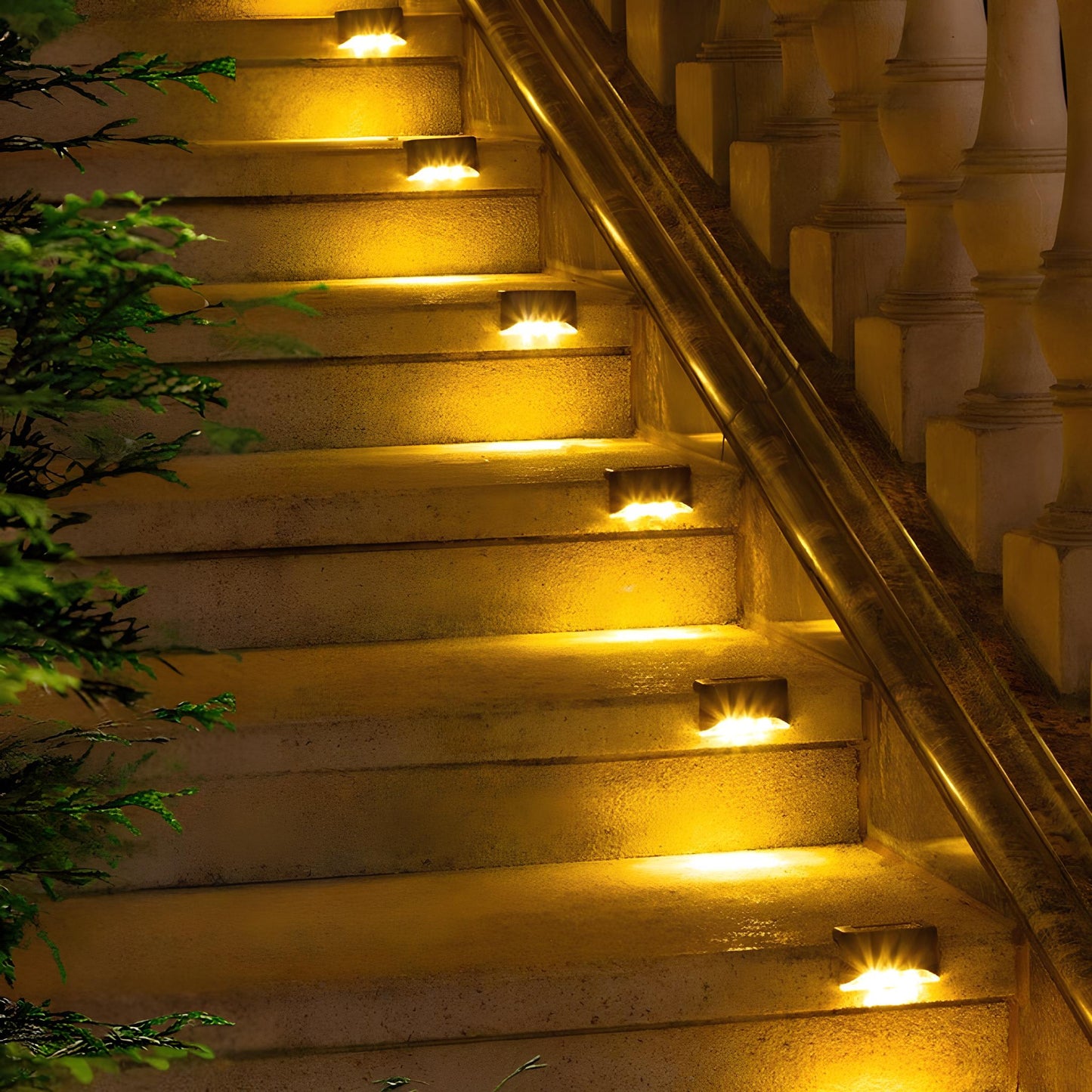 Staircase with embedded lights illuminating the steps at night.