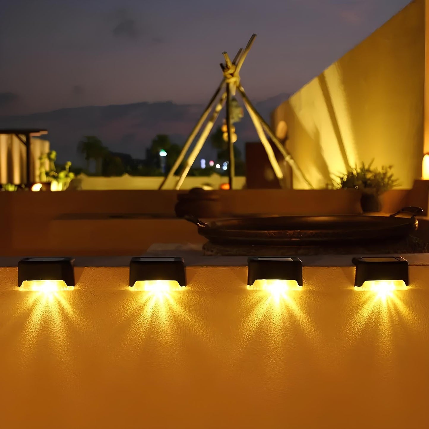 Solar-powered deck lights on a patio with a tent and outdoor furniture in the background.