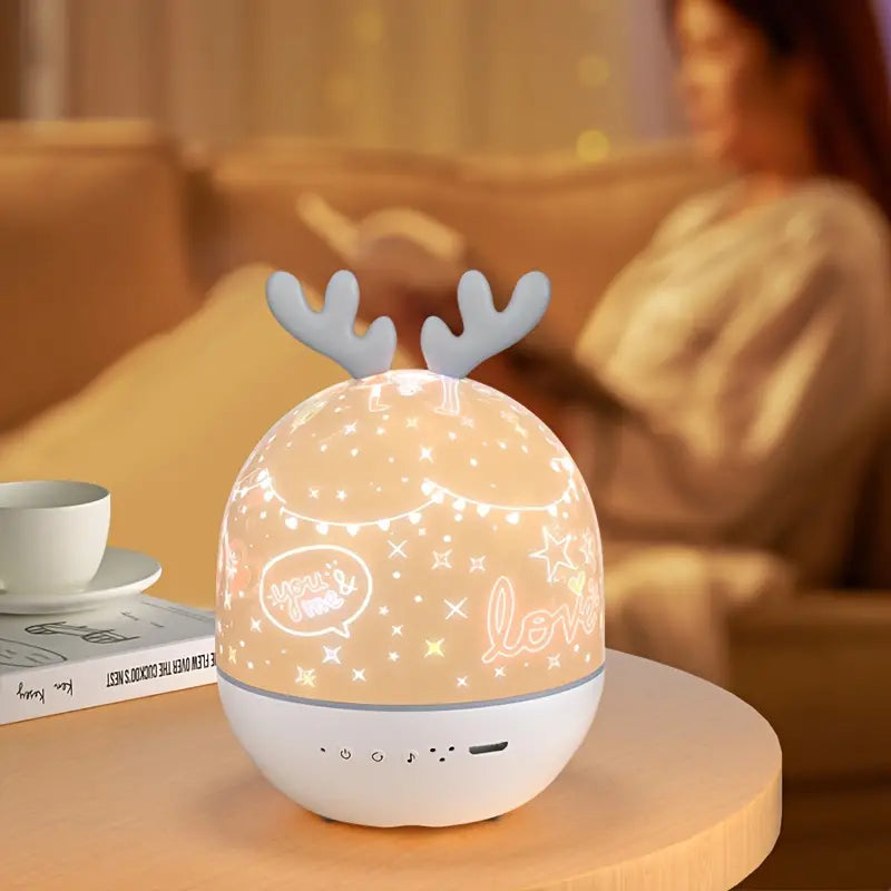 Decorative lamp with reindeer antlers on a table in a cozy room.