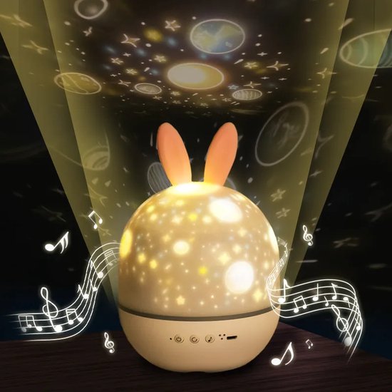 Children's night light with rabbit design projecting stars and music notes on a ceiling.