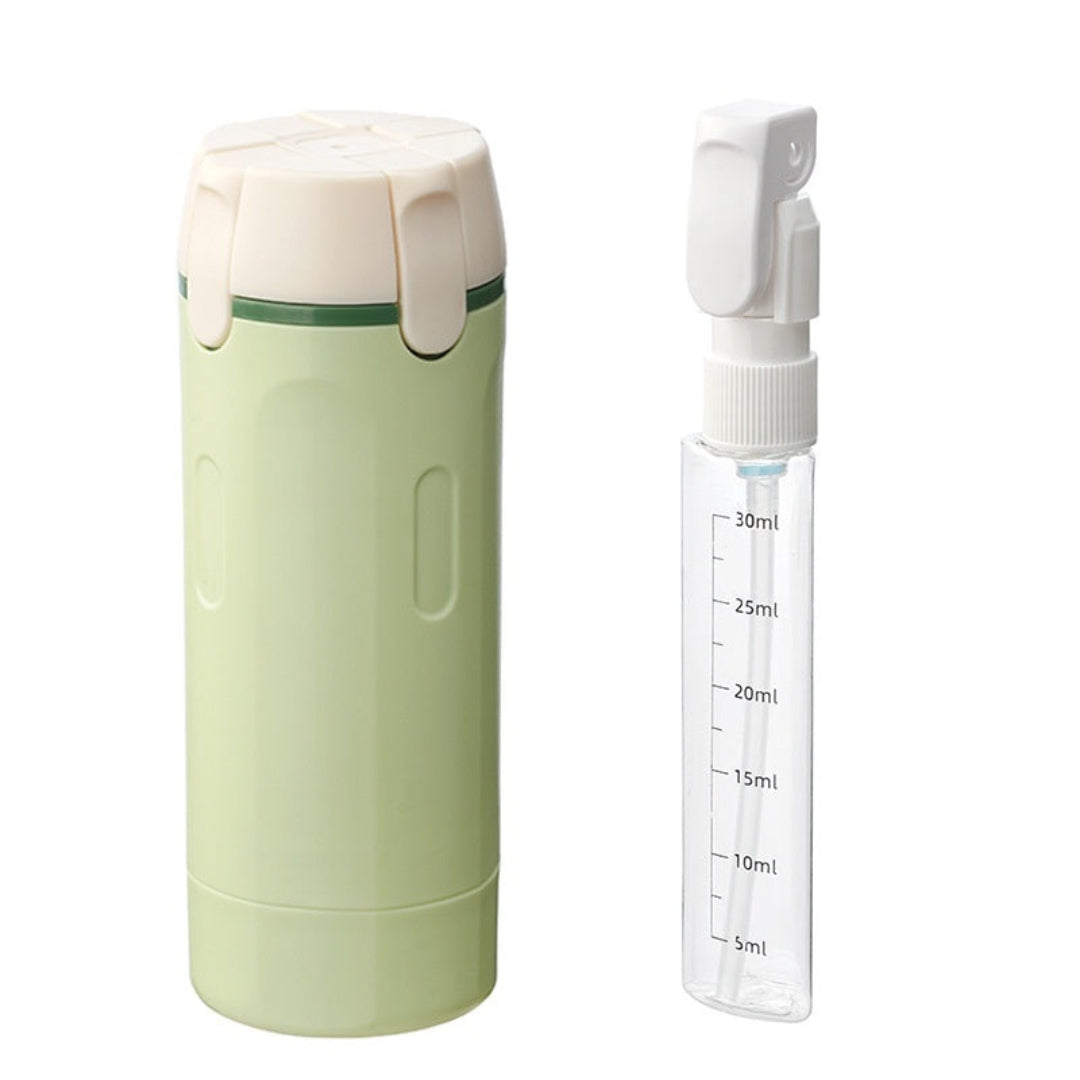 Green travel mug with a white spray nozzle on a white background
