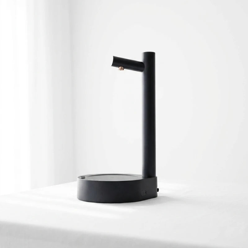 Josh & Tate - TapFlow™ Desktop Water Dispenser - Black lamp on a white surface with a white background