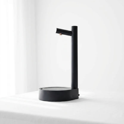 Josh & Tate - TapFlow™ Desktop Water Dispenser - Black lamp on a white surface with a white background