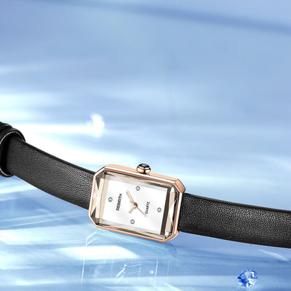 Wristwatch with black strap and rose gold case on a blue abstract background