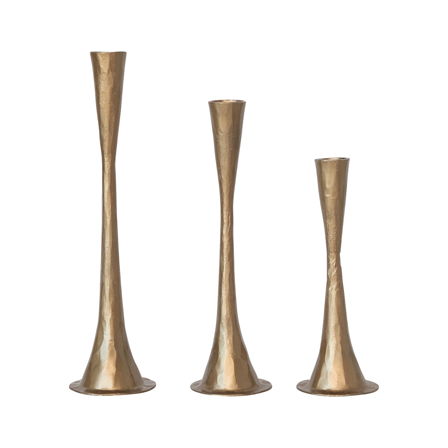 Three gold metallic candle holders on a white background