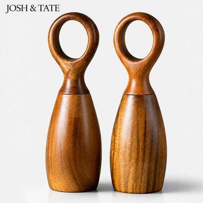Josh & Tate - Arden Wooden Salt & Pepper Mills - Two wooden salt and pepper shakers with circular handles on a white background, branded 'Josh & Tate'.