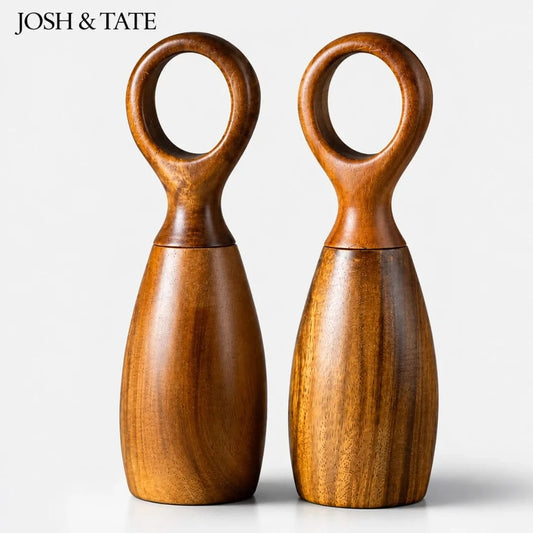 Josh & Tate - Arden Wooden Salt & Pepper Mills - Two wooden salt and pepper shakers with circular handles on a white background, branded 'Josh & Tate'.