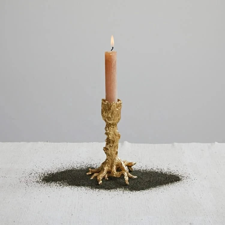 Josh & Tate - Artemis Taper Candle Stand - Set of 2 - Candle in a decorative gold holder on a gray background