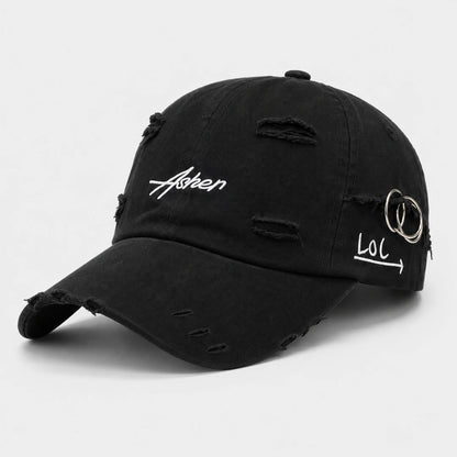 Josh & Tate A black distressed baseball cap with white embroidered text reading 'Asben' on the front and 'LOL' with a ring detail on the side, shown on a light gray background. AsherLOL™ Distressed Cap - 