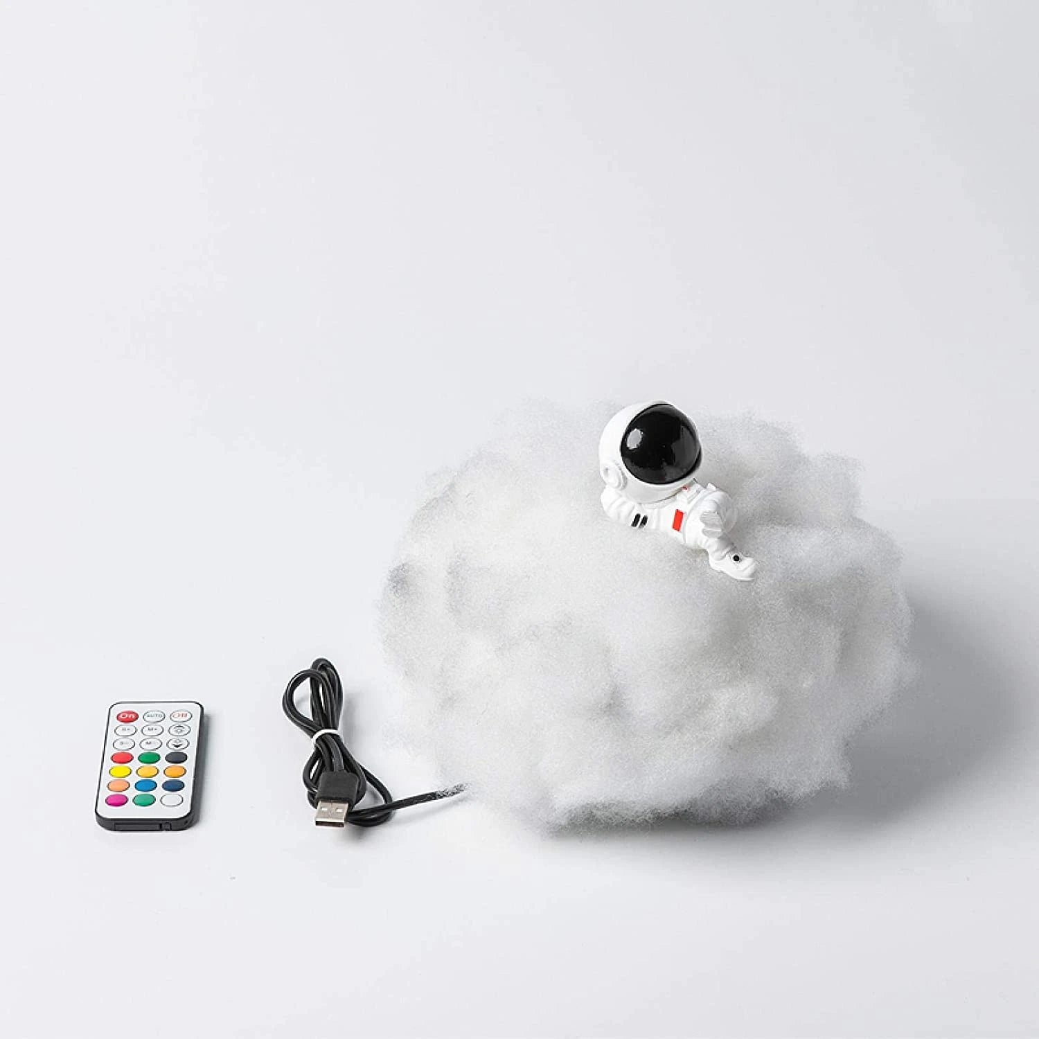 Josh & TSate - Astronaut Cloud Lamp - Toy robot with remote control and cable on a white background