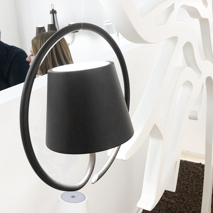 Modern black pendant light fixture on a white background