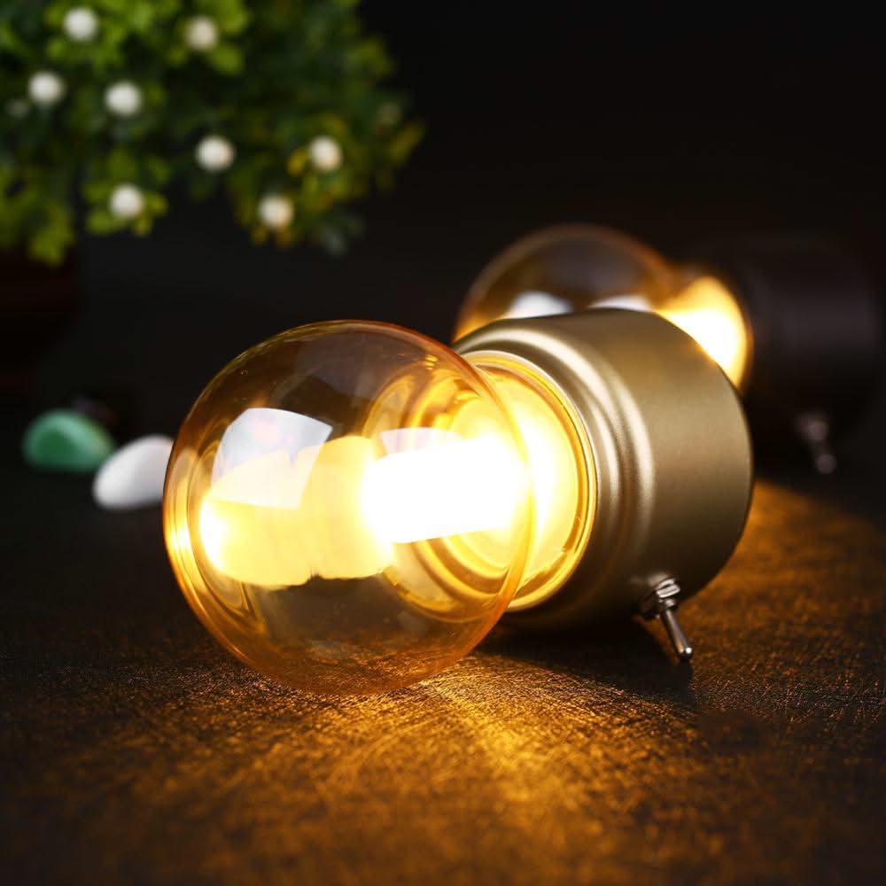 Light bulb on a dark surface with a blurred background