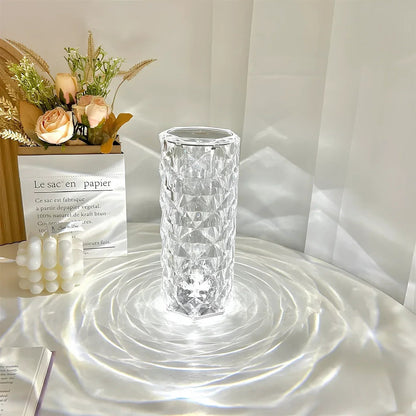 Clear glass vase on a white surface with a soft light background