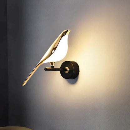 Modern wall lamp with gold leaf design on a gray wall