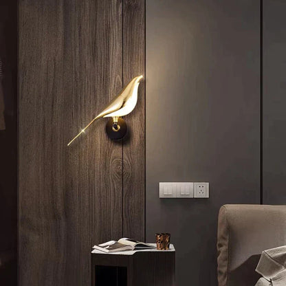 Decorative wall light shaped like a bird on a wooden panel wall.