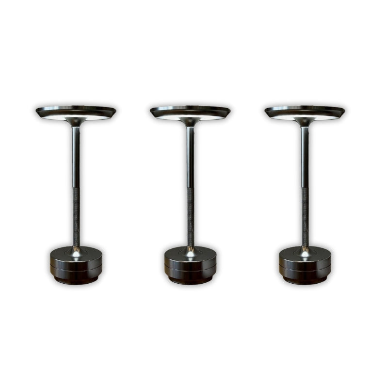 Three black and chrome pedestal stands on a white background