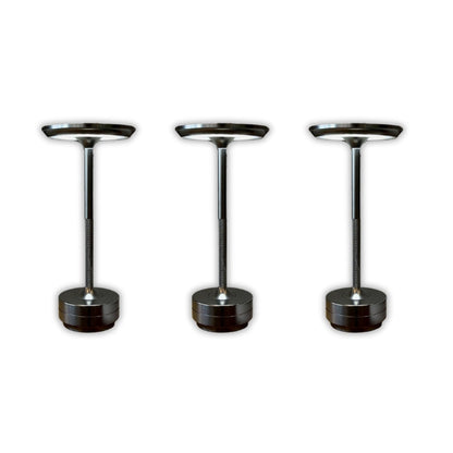 Three black and chrome pedestal stands on a white background