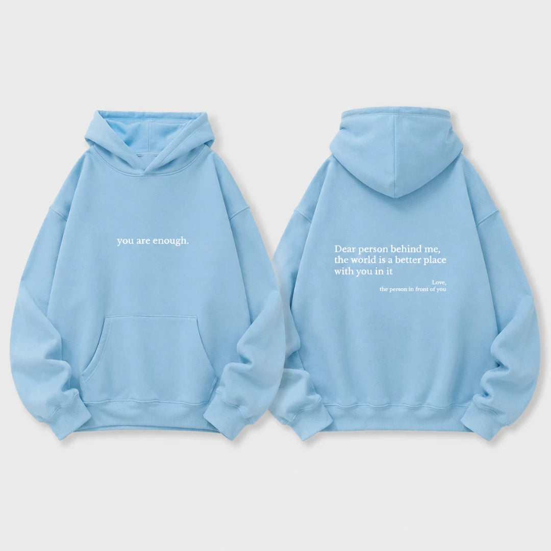 Josh & Tate - BehindMe™ Quote Hoodie - A light blue hoodie shown from both the front and back on a light gray background. The front features the white text 'you are enough.