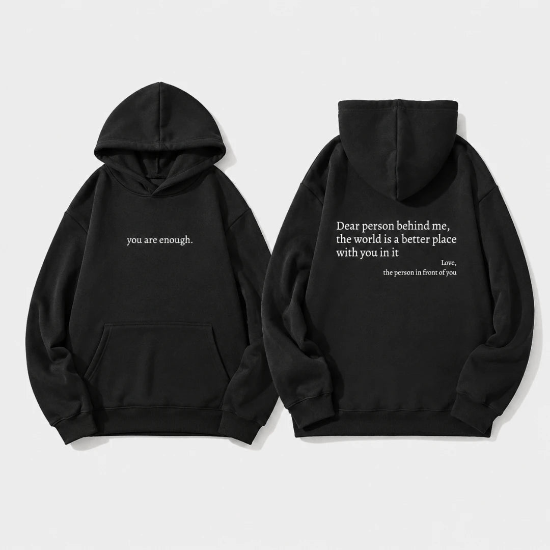 Josh & Tate - BehindMe™ Quote Hoodie - Two black pullover hoodies shown on a light gray background, displaying the front and back views. The front hoodie features the white printed text 'you are enough.