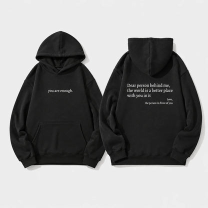 Josh & Tate - BehindMe™ Quote Hoodie - Two black pullover hoodies shown on a light gray background, displaying the front and back views. The front hoodie features the white printed text 'you are enough.