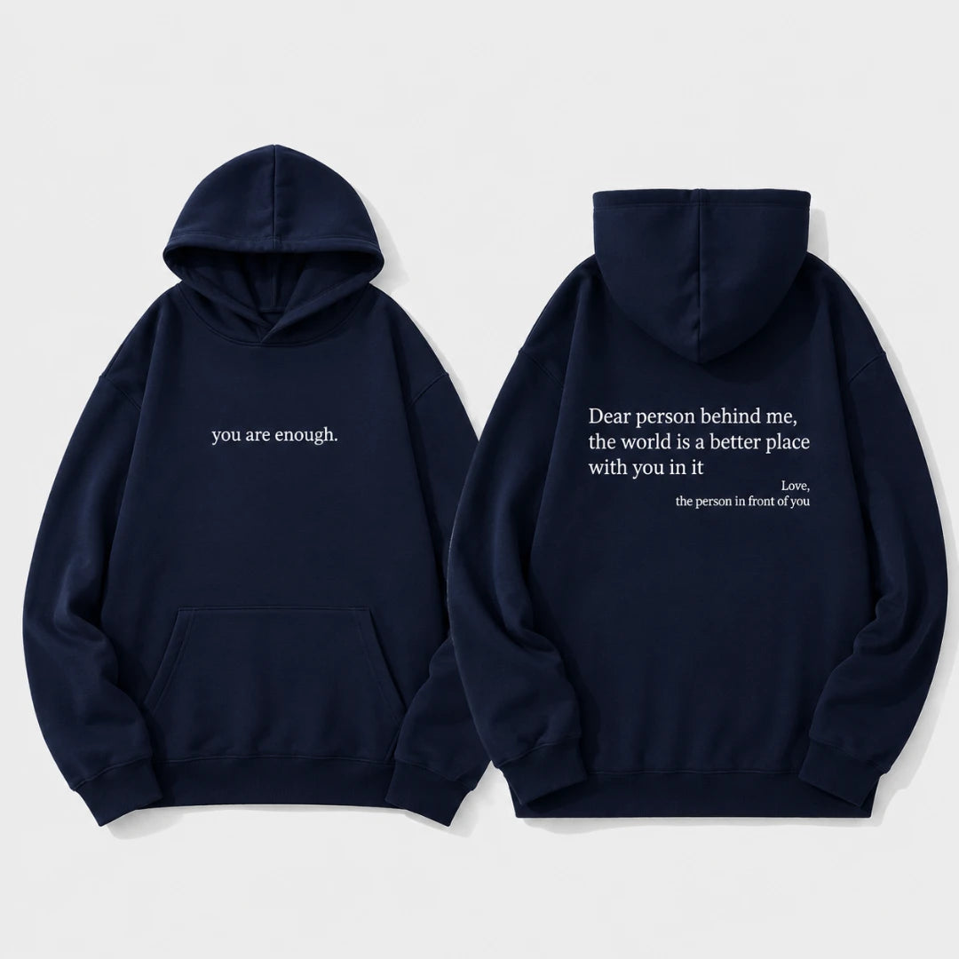 Josh & Tate - BehindMe™ Quote Hoodie - Two navy blue hoodies shown on a light gray background, displaying the front and back views. The front features the white text 'you are enough.