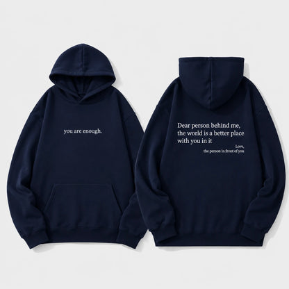 Josh & Tate - BehindMe™ Quote Hoodie - Two navy blue hoodies shown on a light gray background, displaying the front and back views. The front features the white text 'you are enough.