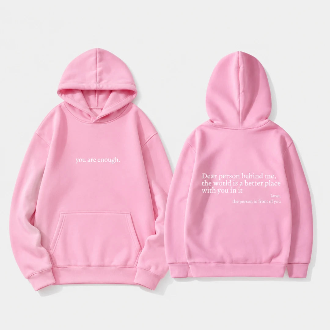 Josh & Tate - BehindMe™ Quote Hoodie - A pink pullover hoodie shown from both the front and back on a light gray background. The front features the phrase 'you are enough.