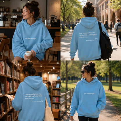 Josh & Tate - BehindMe™ Quote Hoodie - A four-panel collage showing a woman wearing a light blue hoodie in different real-world settings: a cafe, outdoors on a street, in a library, and walking on a park path. The hoodie has white printed text on the chest and back.