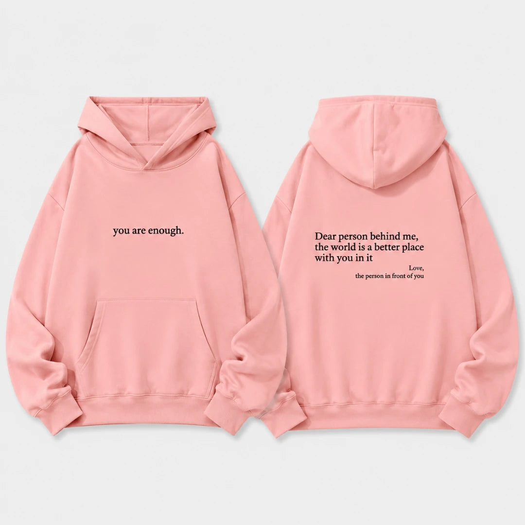 Josh & Tate - BehindMe™ Quote Hoodie - A light pink pullover hoodie shown from both the front and back on a clean white background. The front features the text 'you are enough.