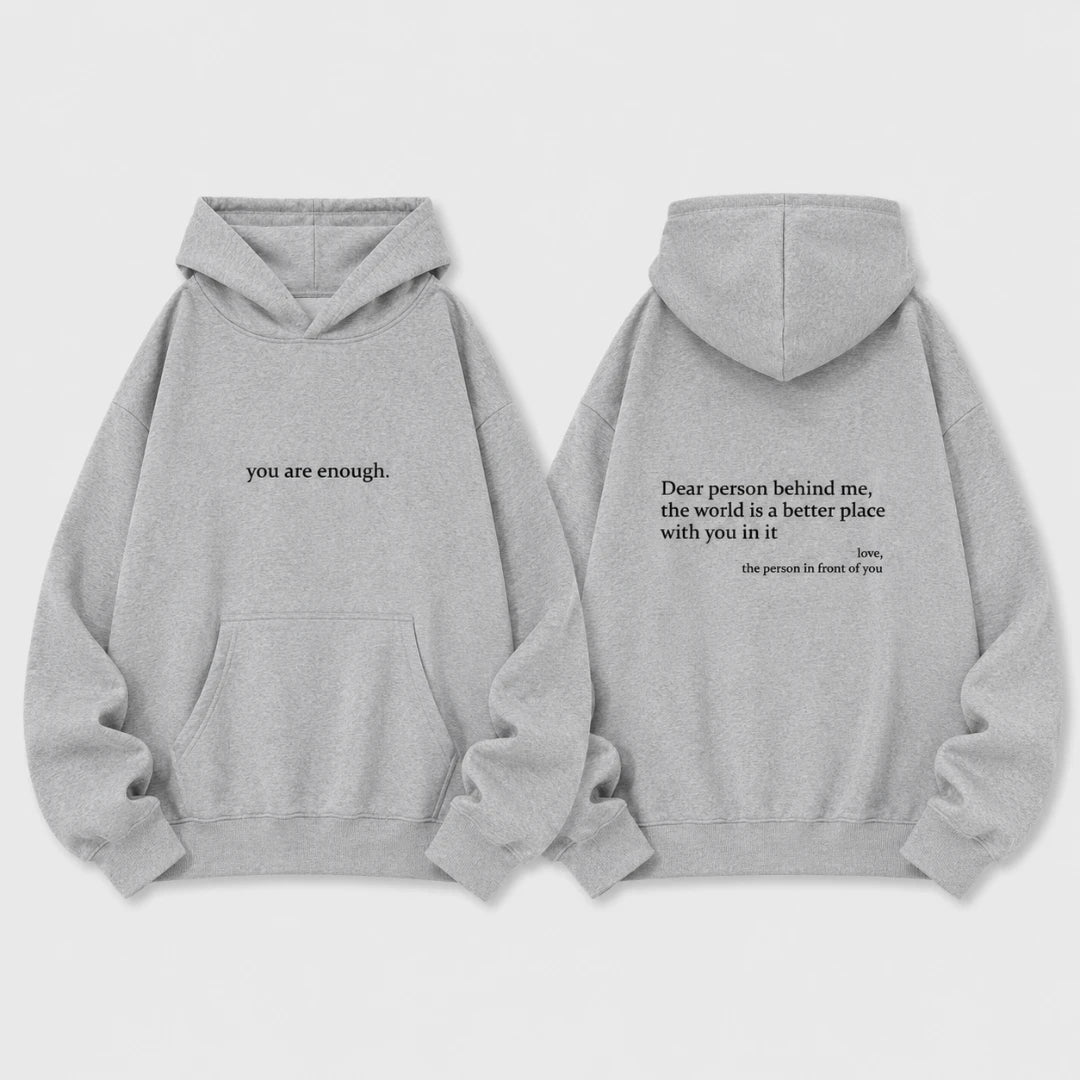 Josh & Tate - BehindMe™ Quote Hoodie - Two light gray hoodies shown front and back on a plain light background. The front hoodie has the phrase 'you are enough.