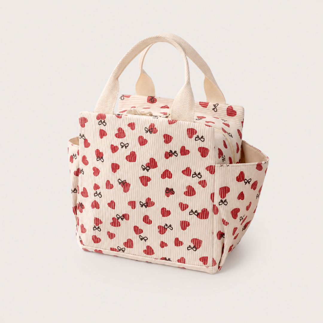 Josh & Tate - BentoCarry™ Insulated Lunch Bag - Tote bag with heart and bow pattern on a light gray background