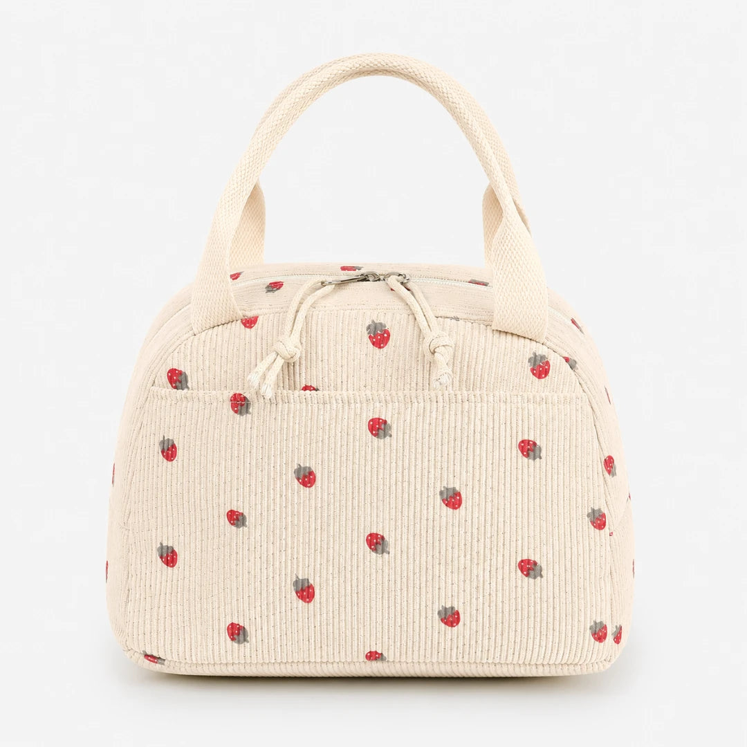 Josh & Tate - BerryTote™ Insulated Lunch Bag - An off-white corduroy lunch bag with a small red strawberry pattern, featuring dual top handles and a drawstring closure.