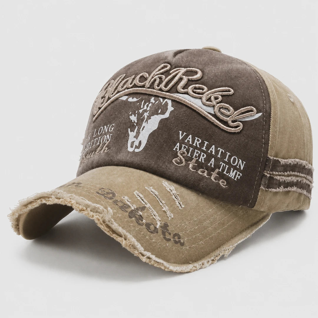 Josh & Tate - BlackRebel™ Distressed Cap - A distressed baseball cap in brown and beige canvas with embroidered text and graphics, including 'Black Rebel' and 'Variation After a TLF State'.