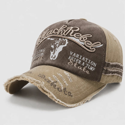 Josh & Tate - BlackRebel™ Distressed Cap - A distressed baseball cap in brown and beige canvas with embroidered text and graphics, including 'Black Rebel' and 'Variation After a TLF State'.