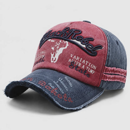 Josh & Tate - BlackRebel™ Distressed Cap - A distressed baseball cap with a split red and blue denim design, featuring embroidered text and graphics including 'Black Rebel' and a white horse silhouette.