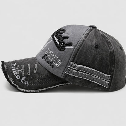 Josh & Tate - BlackRebel™ Distressed Cap - A dark gray washed denim baseball cap with distressed details, featuring black embroidered script on the front and white text on the brim, set against a light gray background.