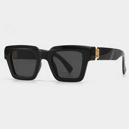 Josh & Tate - BlockFrame™ Bold Square Sunglasses - Black square sunglasses with dark lenses and a gold accent on the temple, shown on a light gray background.