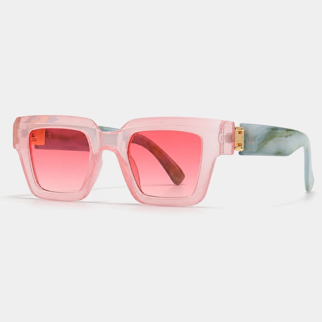 Josh & Tate - BlockFrame™ Bold Square Sunglasses - Square sunglasses with translucent pink frames, pink-tinted lenses, and light blue-green marble-patterned temples with gold metal hardware, shown on a light gray background.