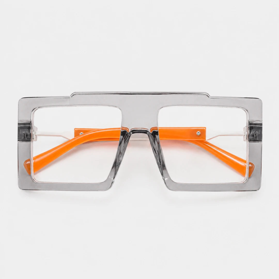 Josh & Tate - BoldFrame™ Square Glasses - A pair of oversized square sunglasses with a translucent gray frame and bright orange temples, shown against a plain white background.