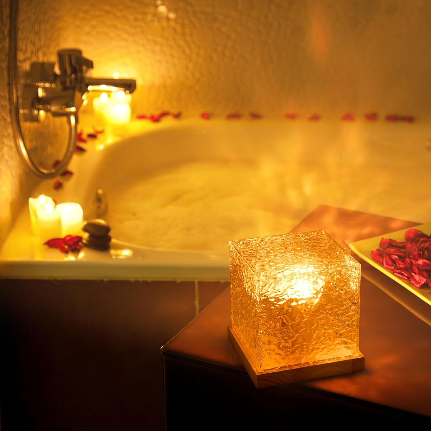 Relaxing bath scene with lit candles and rose petals in a warm, cozy setting.