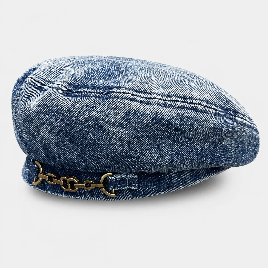 Josh & Tate - BrixChain™ Washed Denim Beret - A blue denim newsboy cap with a decorative antique gold-tone metal chain detail on the front, shown against a light gray background.