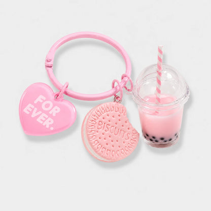 Josh & Tate - BubbleBite™ Milk Tea Keychain - A pink keychain set featuring a heart-shaped charm that reads 'FOR EVER.' and a round biscuit-shaped charm, alongside a miniature pink drink with black pearls and a striped straw, all on a light gray background.