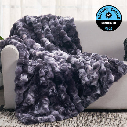 Gray textured blanket draped over a white couch with 'Editors' Choice' badge in the corner.