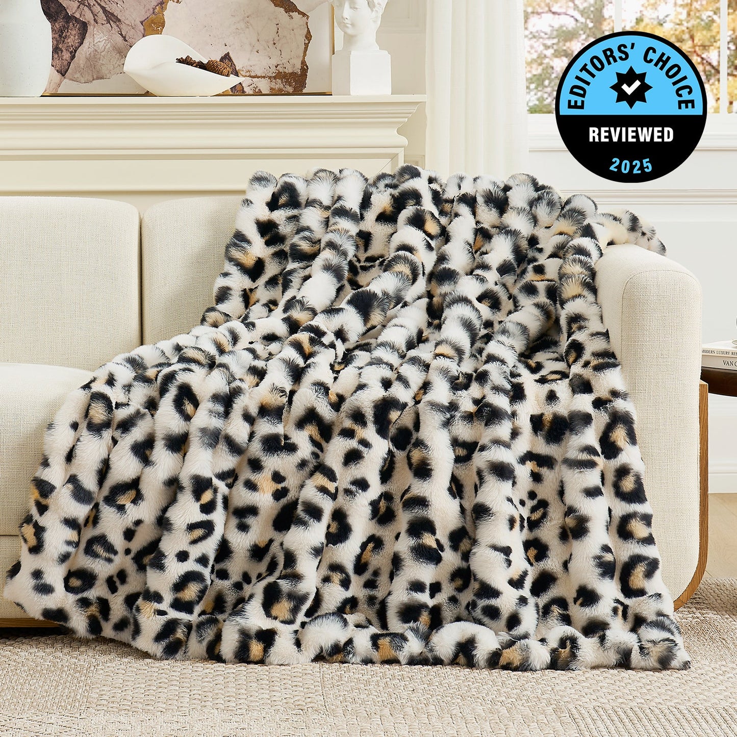 Leopard print blanket draped over a sofa with 'Editors' Choice' badge in the corner.