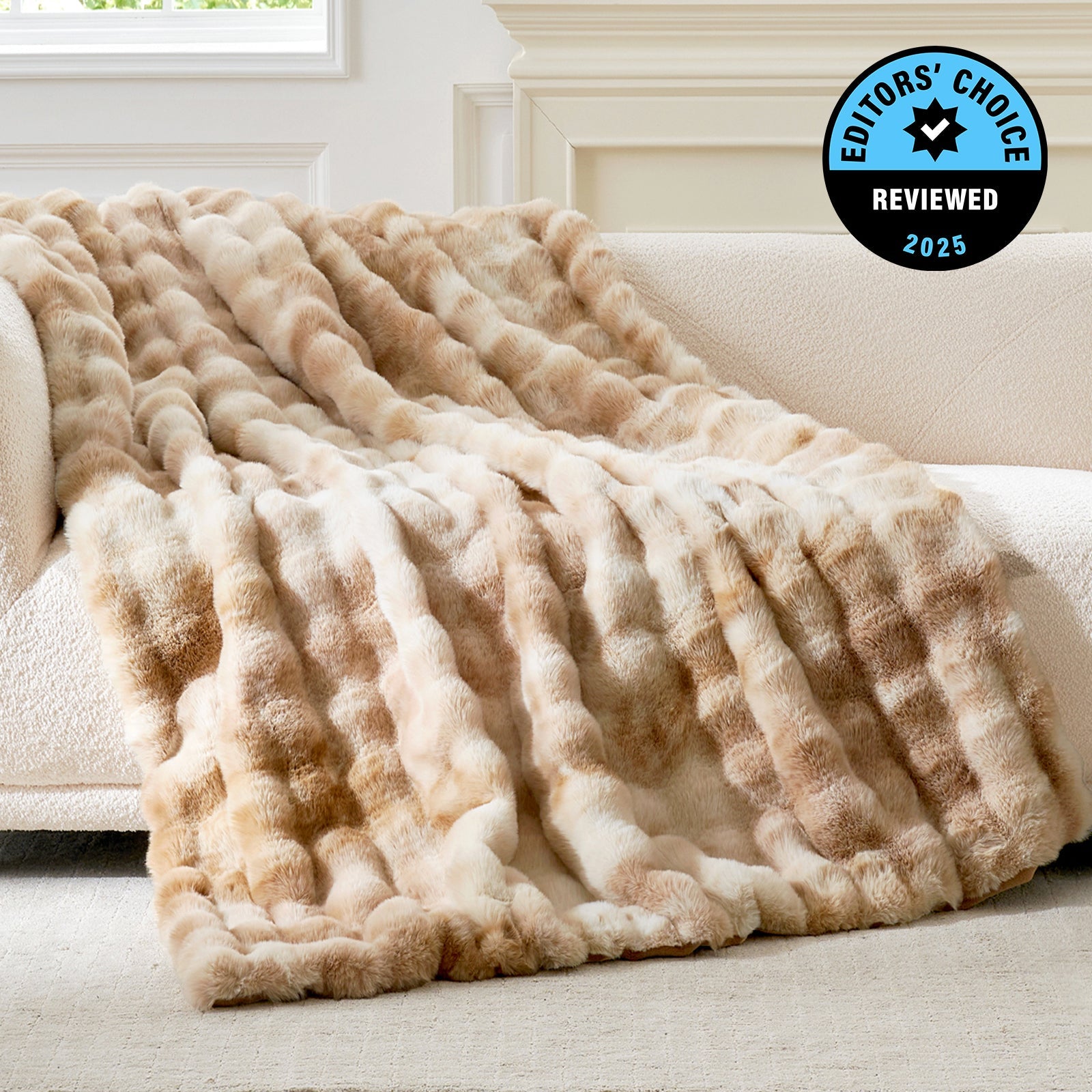 Beige textured blanket draped over a couch with 'Editors' Choice' badge in the corner.
