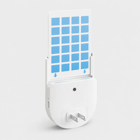 Josh & Tate - BugSheet™ Sticky Mosquito Catcher - A white electronic plug-in device with a hinged cover that opens to reveal a grid of blue square panels, shown on a clean light gray background.