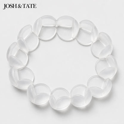 Josh & Tate - BumperBall™ Corner Protectors - Clear bracelet on a light gray background with 'JOSH & TATE' branding.