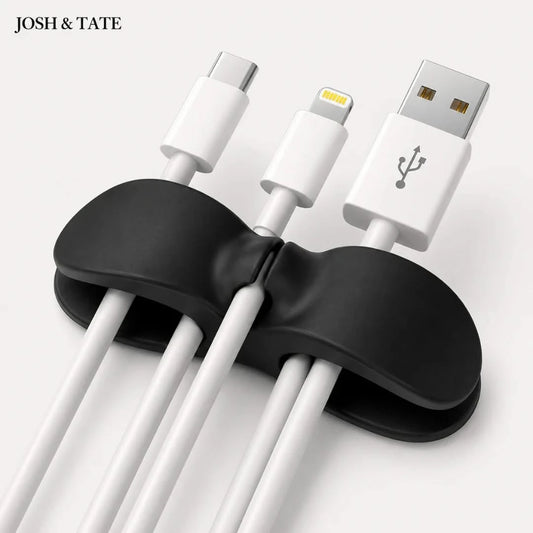 Black cable organizer holding multiple USB cables on a white background with 'JOSH & TATE' branding.