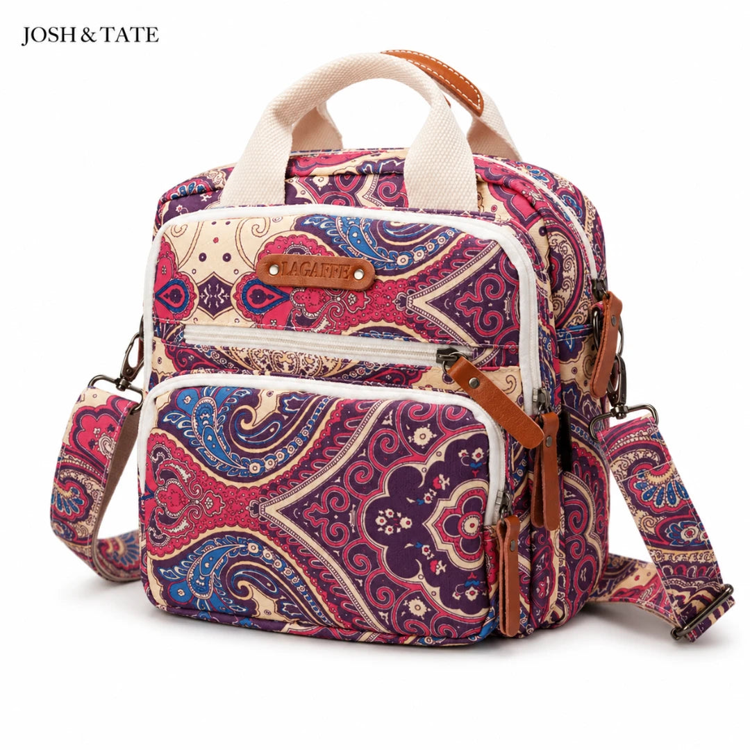 Josh & Tate - CarryAll™ Convertible Baby Bag - Multicolored patterned backpack with shoulder strap on a white background, featuring the brand 'Josh & Tate'.