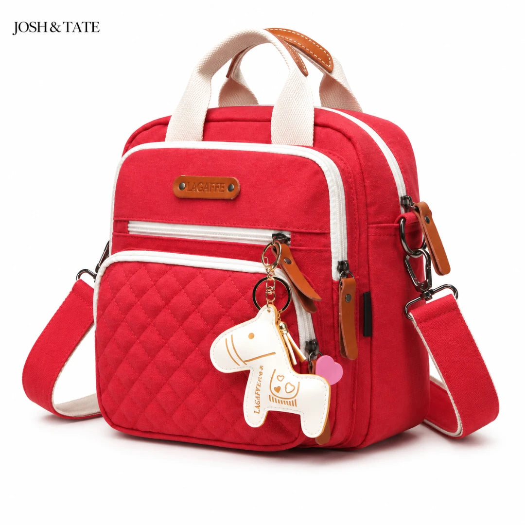 Josh & Tate - CarryAll™ Convertible Baby Bag - Red backpack with white accents and a horse charm on a white background, featuring the brand 'JOSH & Tate'.